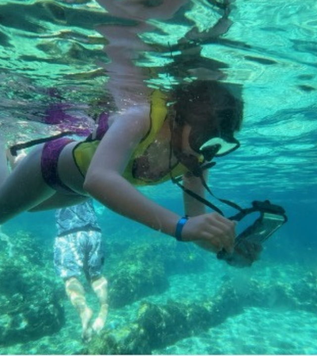 Grace scuba diving in Aulani