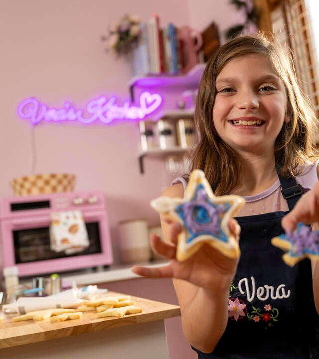 Wish kid Vera baking cookies