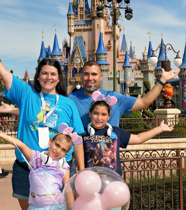 Valentina and family in front of Disney Castle