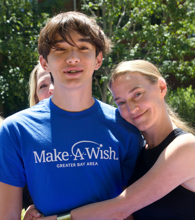 Jonathan and mom, Regina, at wish celebration 