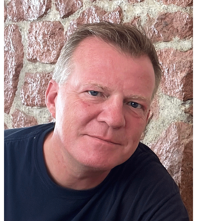 Peter smiling in a photo