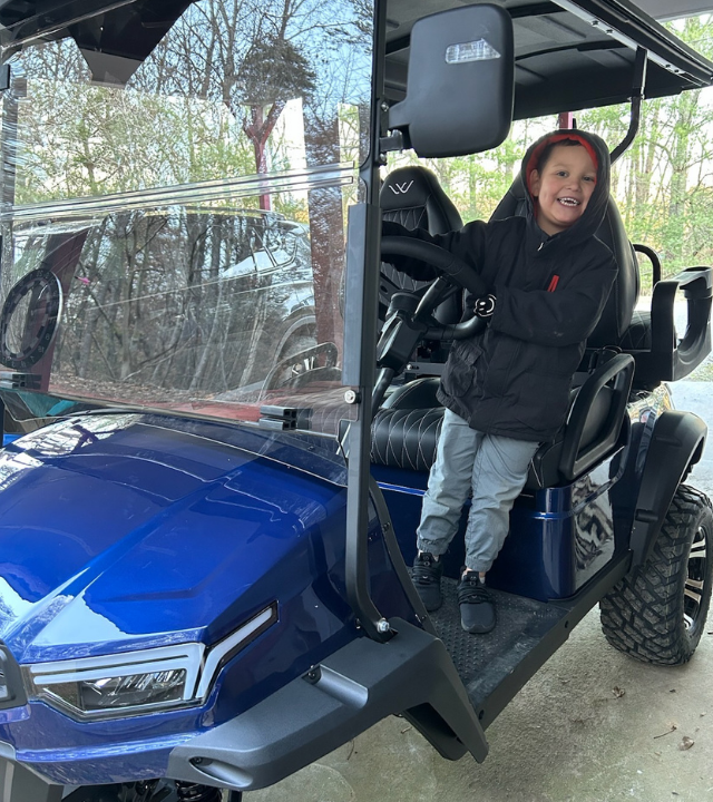 wish kid in golf cart