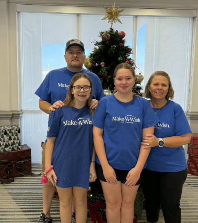 Wish family in front of Christmas tree