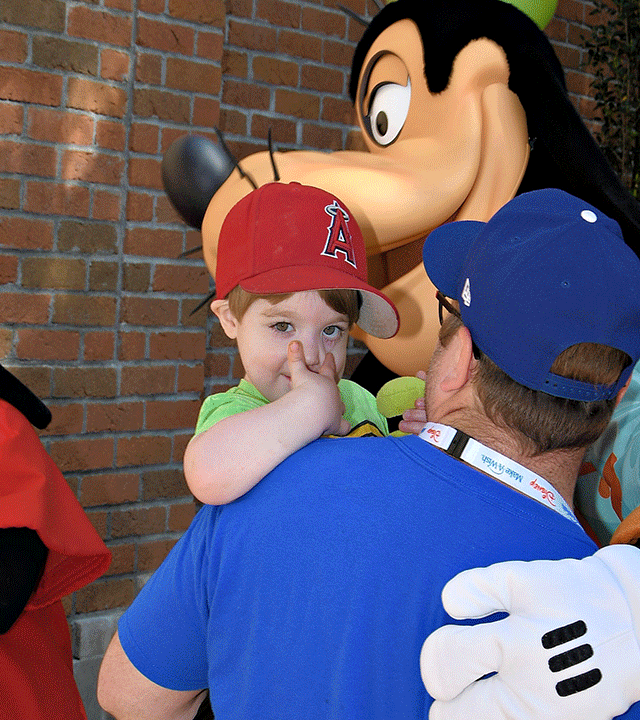 Lucas hugging Goofy