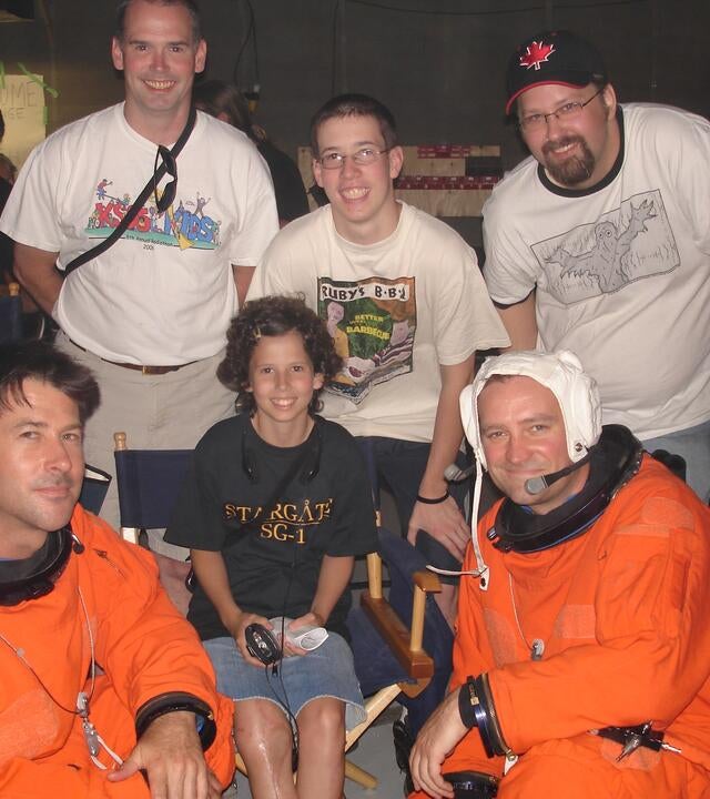 Greg and his daughter and son with actors from Stargate