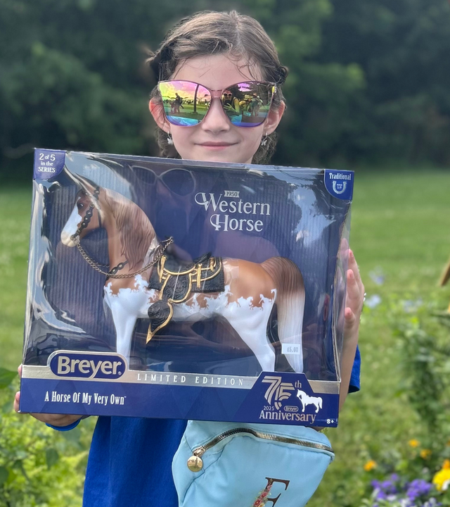 Ella holding a Breyer horse