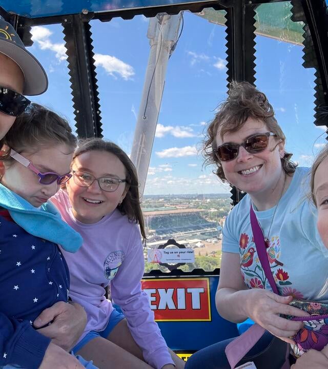 Kate and her family on a ferris wheel at Disney