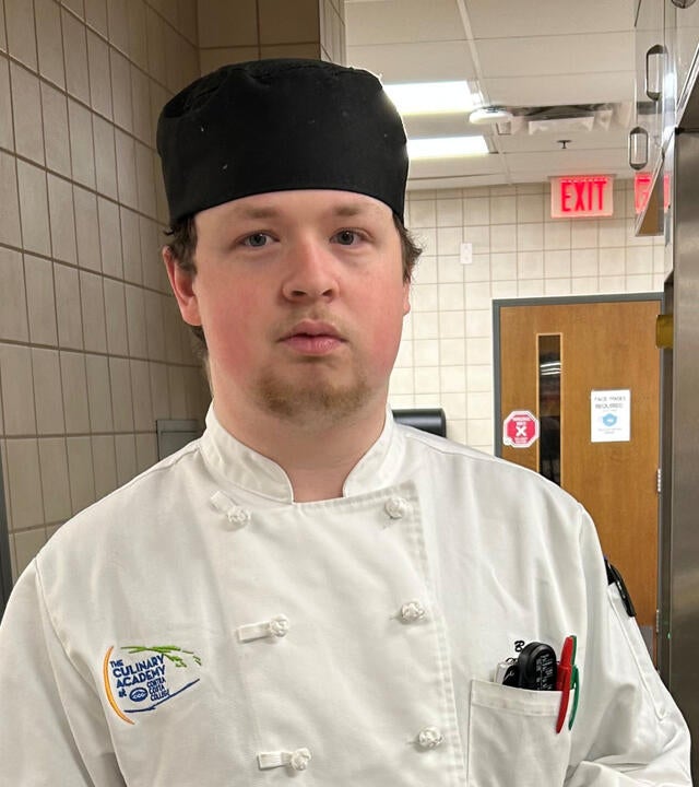 wish alum Ben in his culinary school attire at Contra Costa College with a photo of Ben from 2017 in the right hand corner