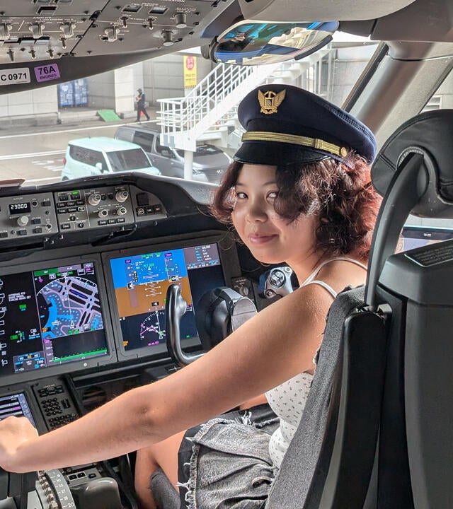 Wish kid Zoey in the cockpit of an airplane