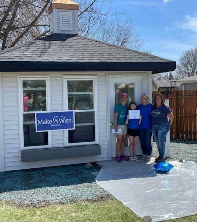 Wish kid Sophia standing in front of her new gazebo