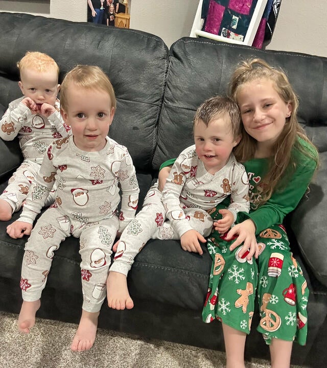 Wish alumni Isaac with his siblings enjoying the home theater from his wish