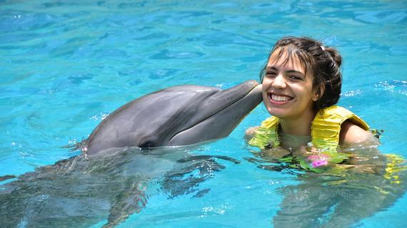 Alexis swimming with the dolphins