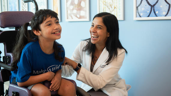 Dr. Kosut smiles with wish kid Camryn at Kapiolani Hospital