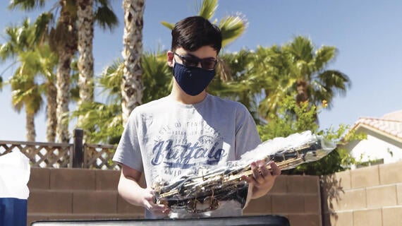 Jon opens his saxophone for the first time