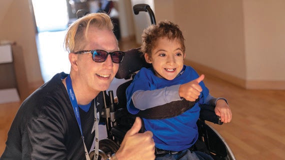 Wish kid Sultan with volunteer Jimmy