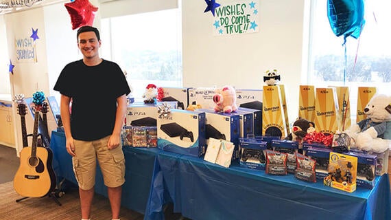 Matthew in hospital with give away toys