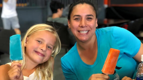 Wish granter Talia with wish kid Ella enjoy a sweet treat.