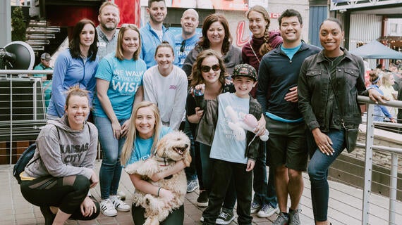 Group of volunteers smiling at the Walk for Wishes annual event