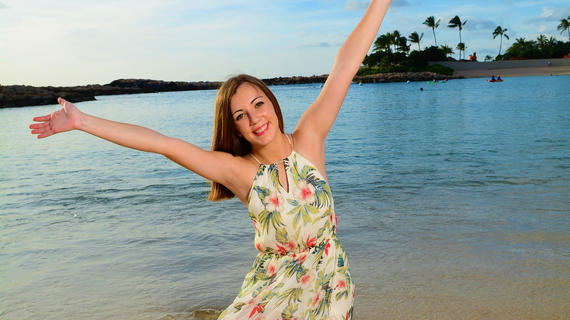Adrianna pictured on the beach during her wish trip to Aulani