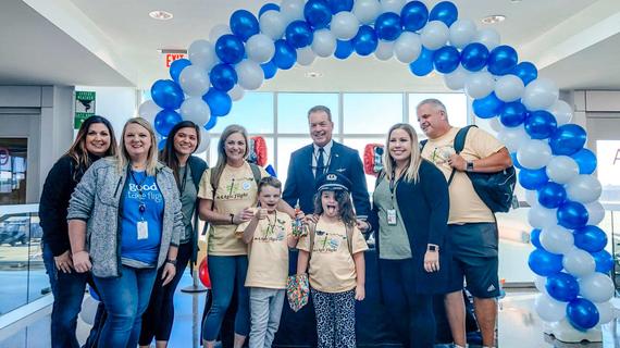 American Airlines employees with wish kid Alexander and family before mAAgic Flight take off
