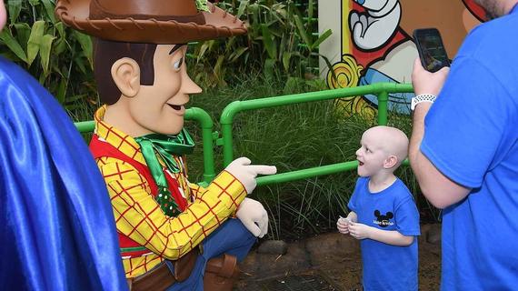 Boy with Woody at Disney World 