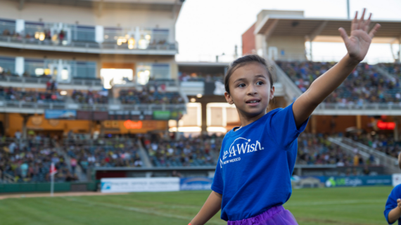 Kayley waving at stadium