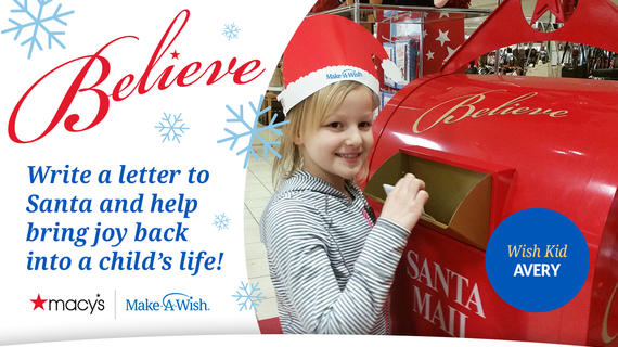 Avery puts her letter to Santa in the red Macy's mailbox.