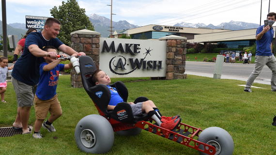 Emery tests out his new off-road wheelchair at A Wishing Place