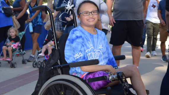 Wish Kid Sammie in her wheelchair at Walk for Wishes