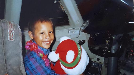 1st wish recipient, John, sits in the airplane cockpit