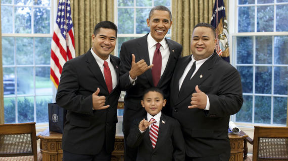 Juan, his dad, and the Saipan congressional delegate "shaka" with President Obama