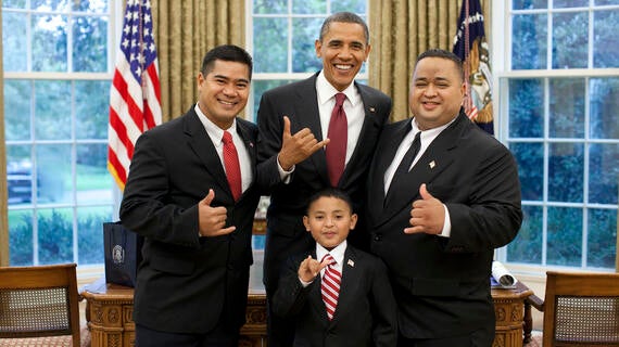 Juan, his dad, and the Saipan congressional delegate "shaka" with President Obama