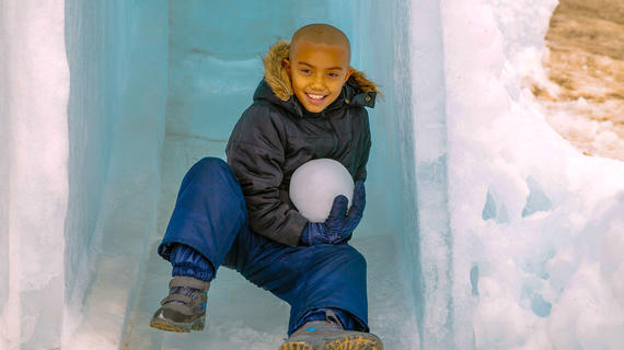 Wish kid Shore in a small ice cave with a giant snowball