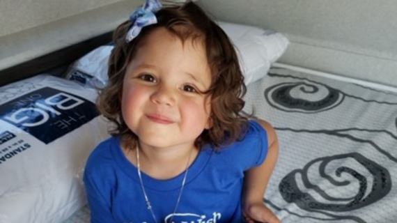 Wish child TInlee smiles from her new travel trailer