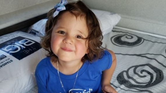 Wish child TInlee smiles from her new travel trailer