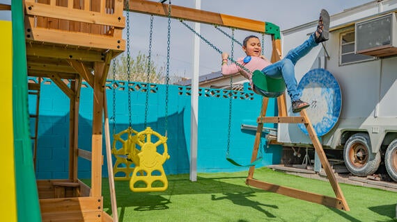 Allison playing on playset