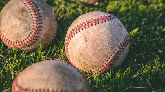 baseballs on green grass