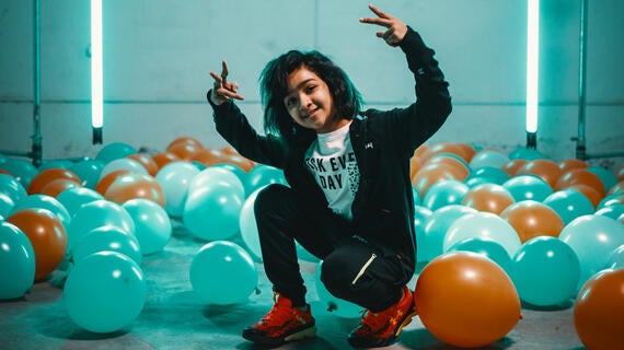 Wish child Miraya in the studio surrounded by bright ballloons as she films her music video for her wish