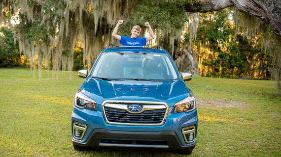 Wish kid Colton in Subaru Forrester