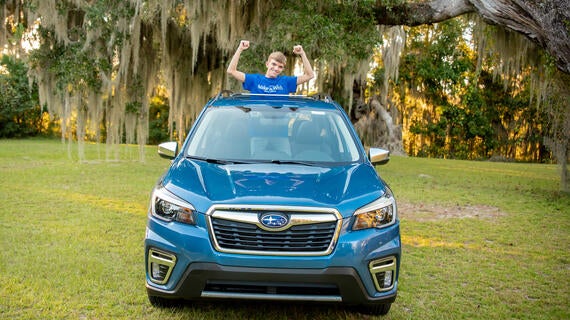 Wish kid Colton in Subaru Forrester