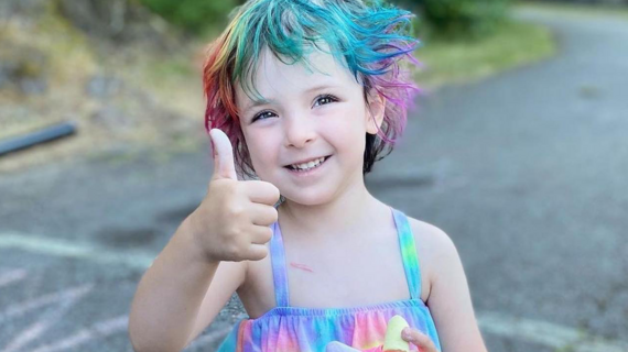 Olivia smiles at the finish line