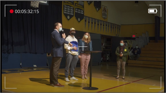 Caleb finds out his wish is coming true in his high school auditorium