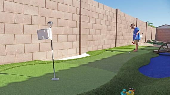 Andrew practices his putts
