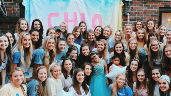 Chi Omegas celebrate with wish kid Pammy during their wish week.