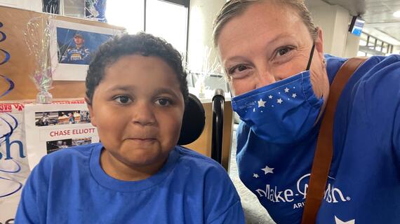 Asea with wish kid Chase at the American Airlines gate