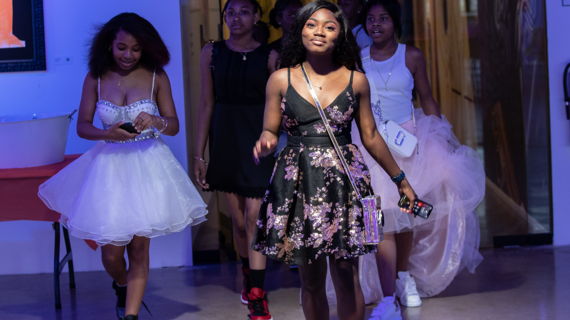 Wish child Zaria walks into her event with friends