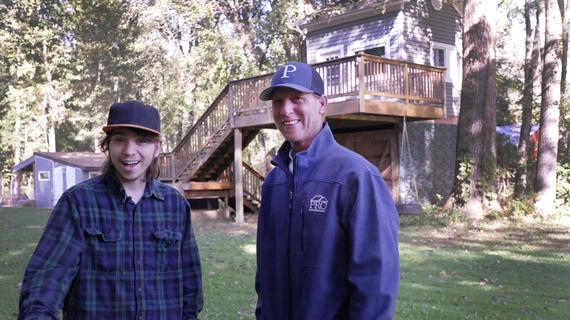 Donor with wish alum outside treehouse