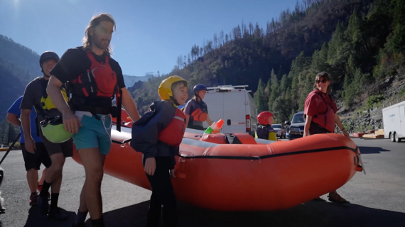Hank and family carry raft