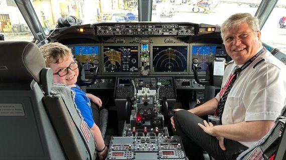 Wish kid Christian and pilot share the cockpit before takeoff