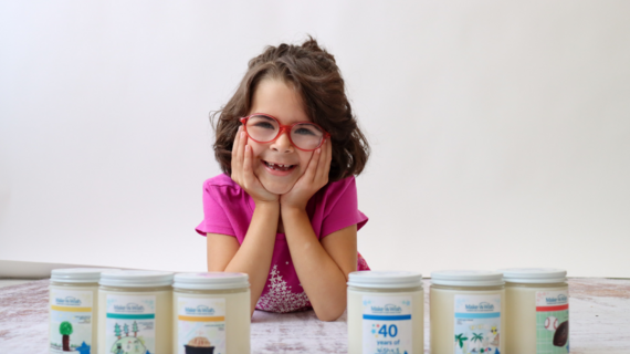Wish kid Raelyn with the full collection of candles